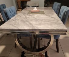 Grey marble dining table and 6 blue suede chairs