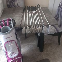 Lady's golf clubs and bag.  Right handed clubs