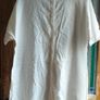 Off white linen button-down  longline tunic featuring a relaxed, oversized silhouette. Image 4