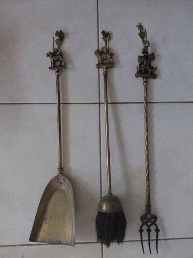 Antique French fireplace set 1950s features handles with various figures with animal finials