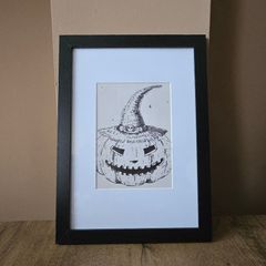 Framed canvas with pumpkin drawing