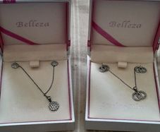 ladies silver chain and pendant and earrings