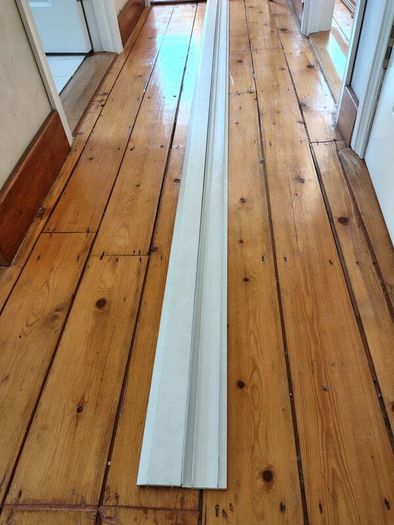 Two 2.6m white plastic lengths.