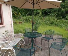 -Piece Vintage Metal Garden Furniture Set (Table, 4 Chairs, Parasol & Rocking Bench)