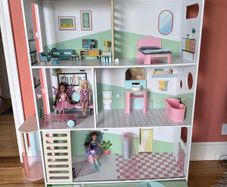 Dolls House with Dolls and Furniture