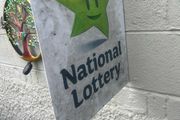 Double sided national lottery wall sign.