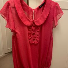 Raspberry pink top with Peter Pan collar and flutter/frill sleeve