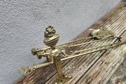 antique polished fire dog and irons