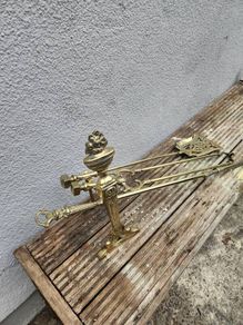 antique polished fire dog and irons