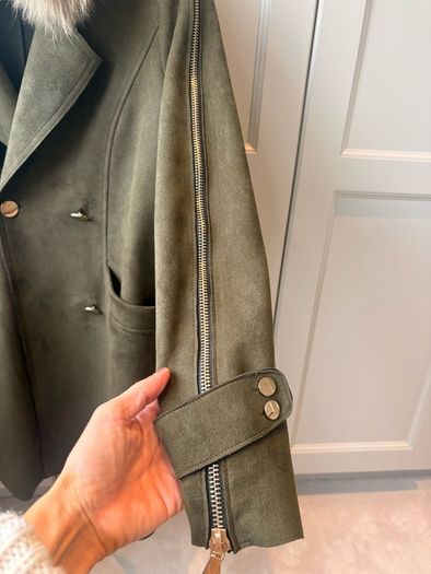 olive green faux-suede double-breasted coat featuring a prominent plush F U R colla