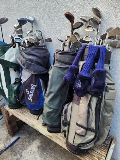 five golf bags and sixty nine clubs . ONE LOT ONLE.