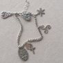 Vintage sterling silver bracelet with charms. Please note that only one charm is not sterling silver. It is a small size, approximately 16/17 cm. Image 2