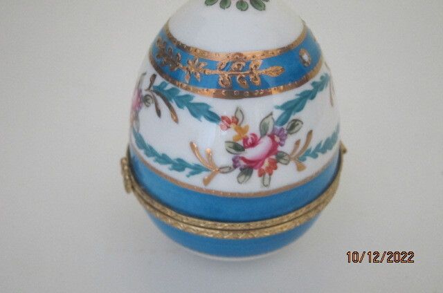Beautifully painted ceramic egg trinket box