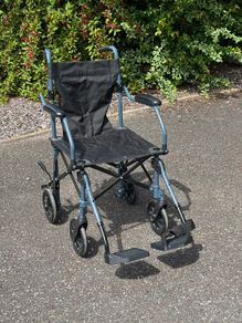 Folding travel wheelchair
