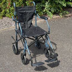 Folding travel wheelchair