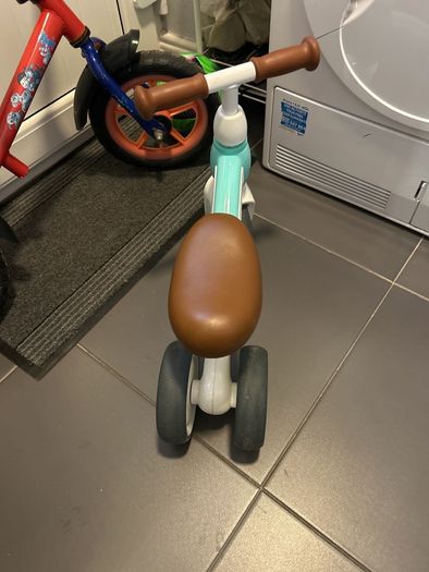 Two toddler bikes and a balance bike