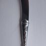A collectible knife made of polished pewter with a stainless steel blade from Carrol Boyes. Image 3