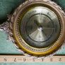 Vintage barometer with silvered dial mounted in an ornate gilt frame. Image 8