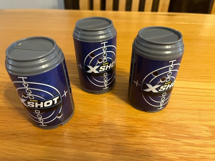 3 Xshot guns and targets and bullets