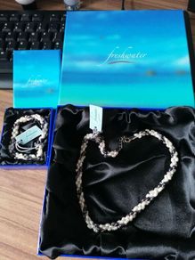 Freshwater pearl necklace and bracelet for sale. New, in original boxes.