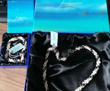 Freshwater pearl necklace and bracelet for sale. New, in original boxes.