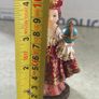 Infant of Prague devotional figurine featuring ornate red and gold robes and a matching crown. Image 2