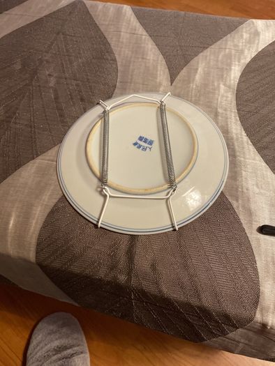 Plate with wall hanger included.