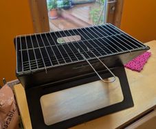 Portable notebook folding grill / firepit