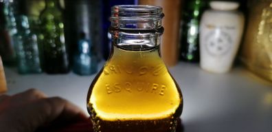 51 - Vintage 1940s Esquire Shoe Polish Emboss Letters Tall Bottle