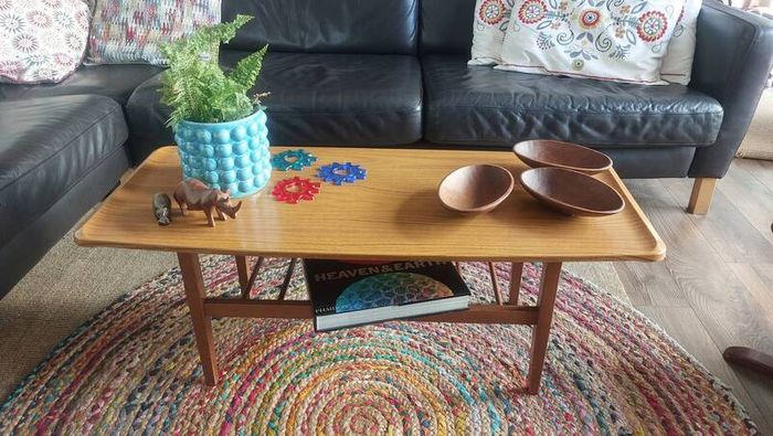 Unusual and Practical Mid-Century Modern Wooden Coffee Table with a Hard-Wearing Wood-Patterned Melamine Top and Slatted Magazine Shelf