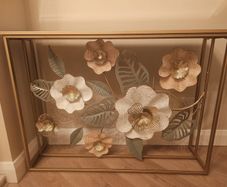 Gold Metal Floral Console table with glass top.