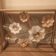 Gold Metal Floral Console table with glass top.