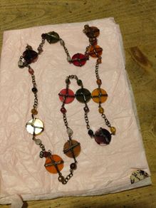 is a bohemian-style wire-wrapped beaded necklace