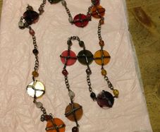 is a bohemian-style wire-wrapped beaded necklace