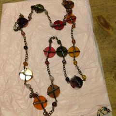 is a bohemian-style wire-wrapped beaded necklace