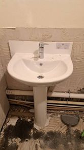 All together - bathtub, sink with a tap, bathtub glass, wall tiles