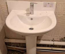 All together - bathtub, sink with a tap, bathtub glass, wall tiles