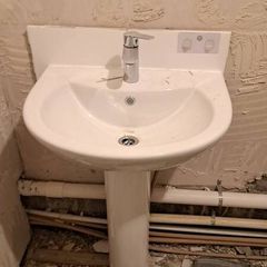 All together - bathtub, sink with a tap, bathtub glass, wall tiles