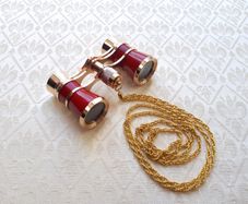 Vintage style opera glasses, small binoculars, red and gold with chain