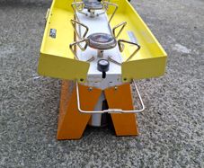 Camping stove with 2 gas bottles.