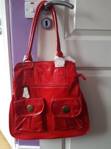 red lacquered hand bag new