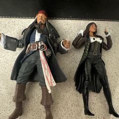 Two figures from Pirates of the Caribbean