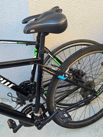Two bikes one mountain one is a type of racing mountain bike