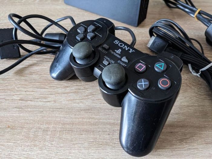 PS2 console with controller and cables