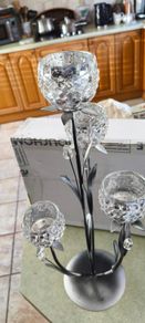 4-arm Flower  crystal tealight candle holder with a metal stand.