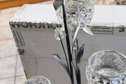 4-arm Flower  crystal tealight candle holder with a metal stand.