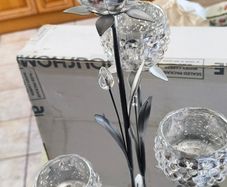 4-arm Flower  crystal tealight candle holder with a metal stand.