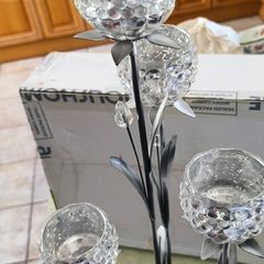4-arm Flower  crystal tealight candle holder with a metal stand.