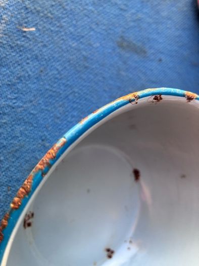 Vintage grey enamel dish with blue rim