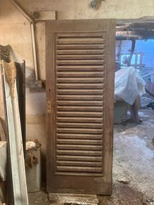 Louvered wood door for laundry or equipment room